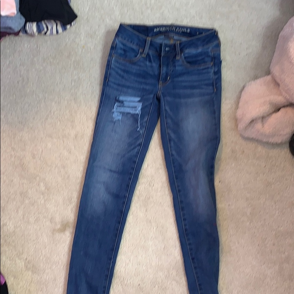 American eagle super stretch blue ripped jeans